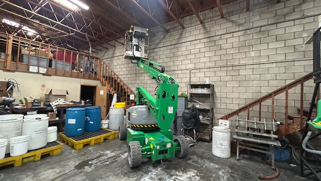 GC Termite Control repair shop with staged lumber, materials, and equipment in San Diego