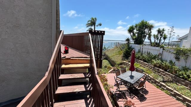Rebuilt wood deck and railing with an ocean view in San Diego