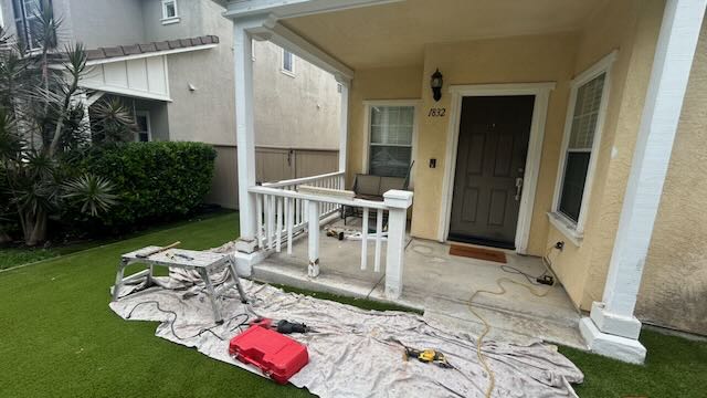 Front porch railing restoration and exterior repaint on a San Diego home